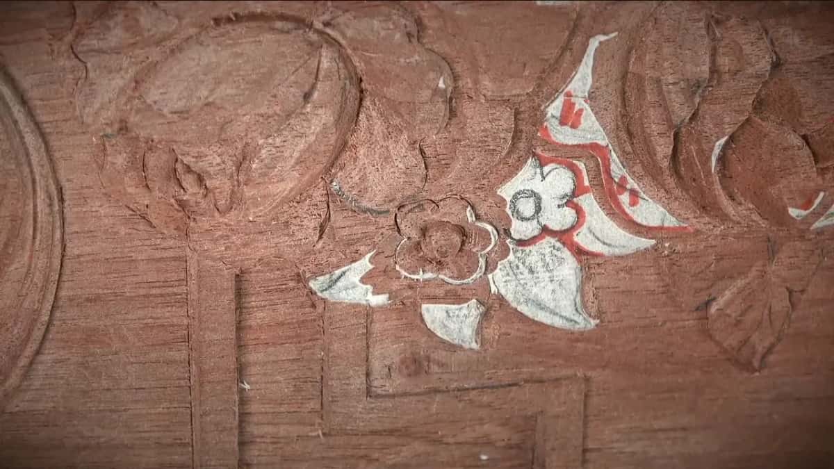 One small rose carved and its neighbour still under paper