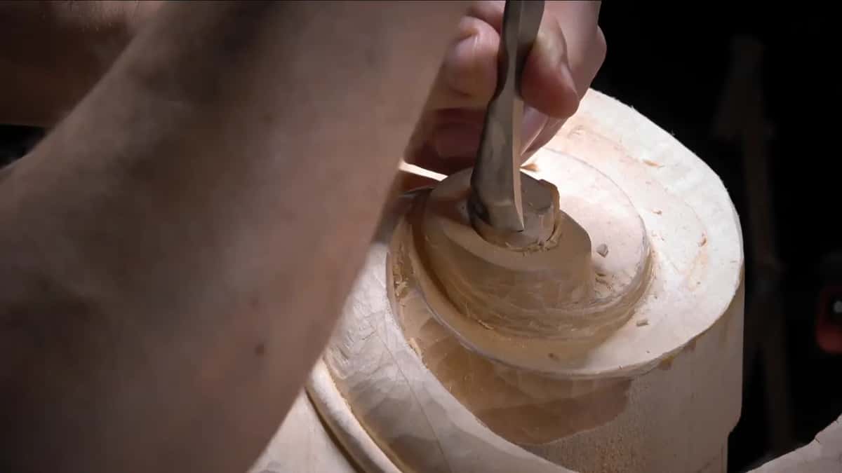 Wide gouge circling the center of the scroll.