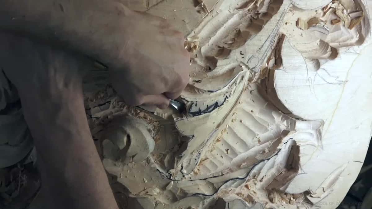 Forearm over the carving.