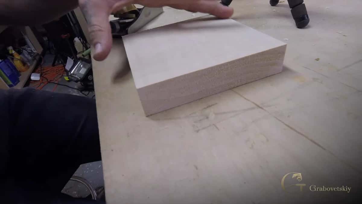 Paper pattern down on the block with a tool already coming in from the right hand side