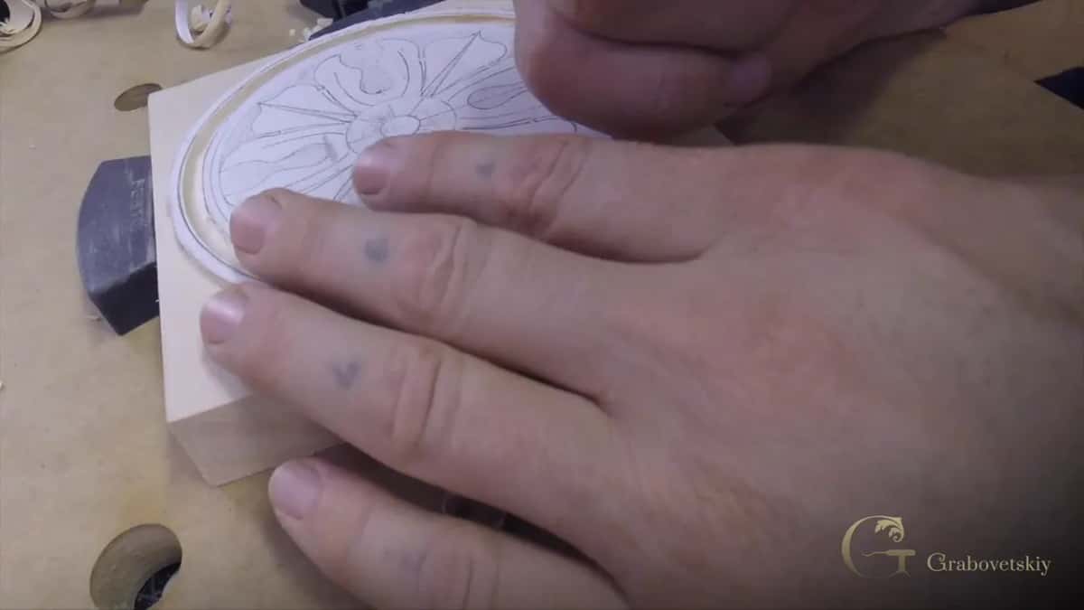 Free hand well clear of the blade, on the side a slip would never reach