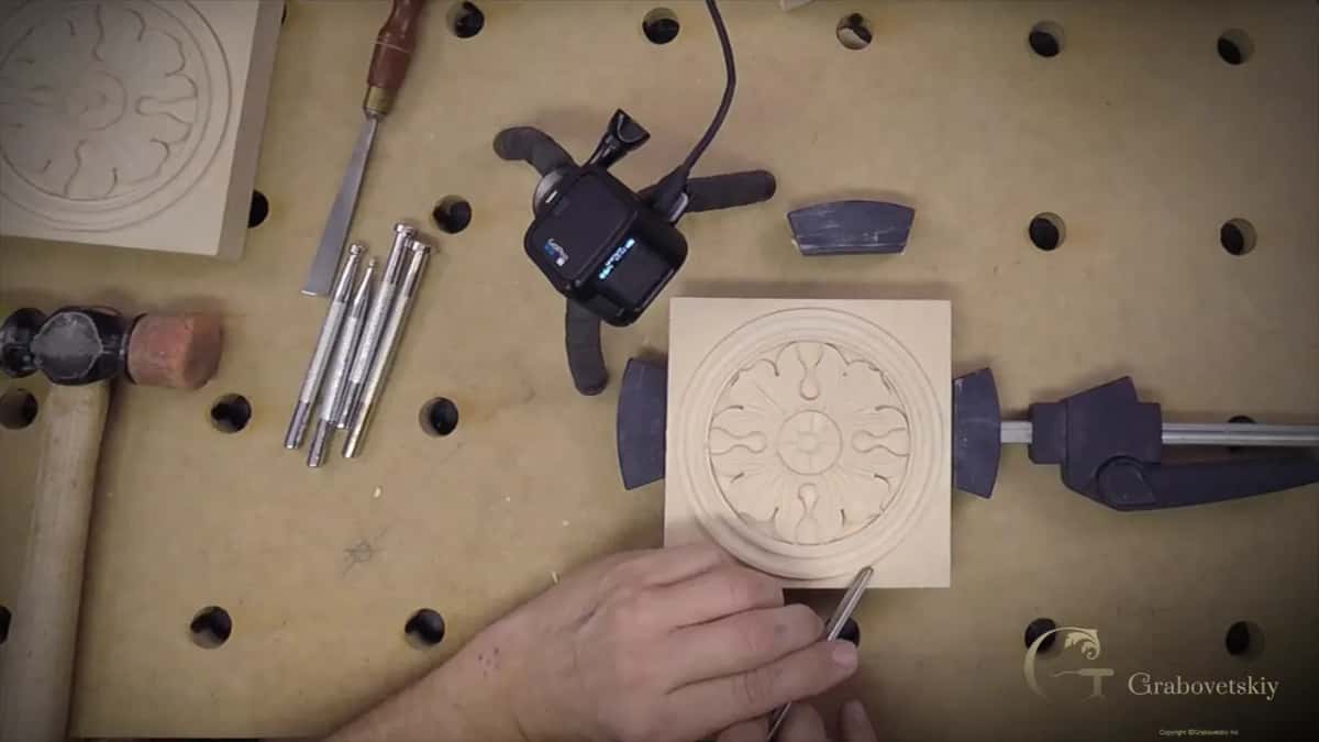 Steel punches laid out beside the mallet, and none of them was made for wood in the first place