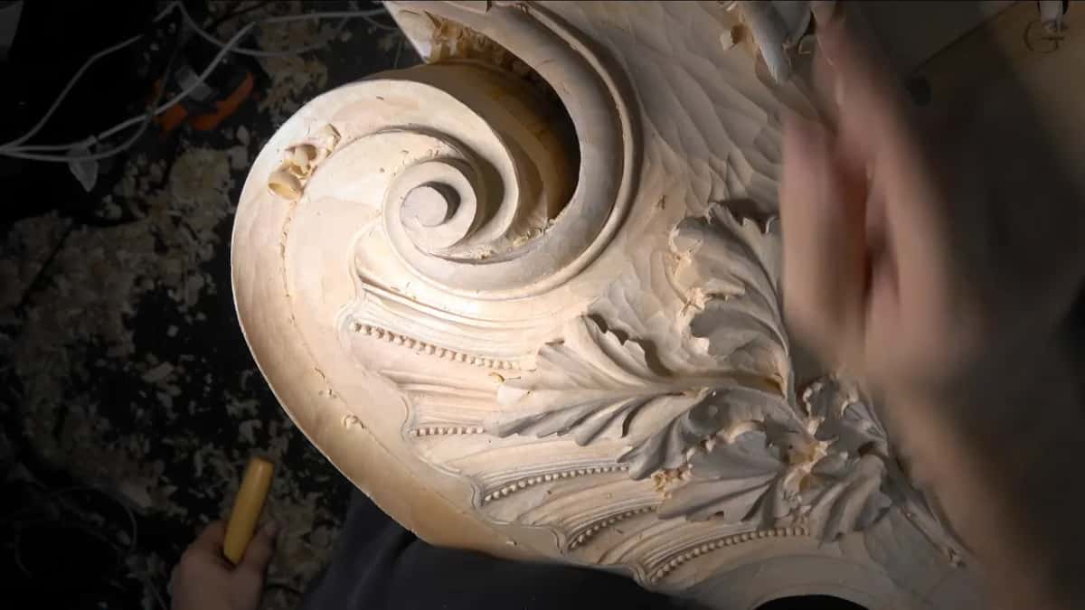 Deep volute spiral above bead molding