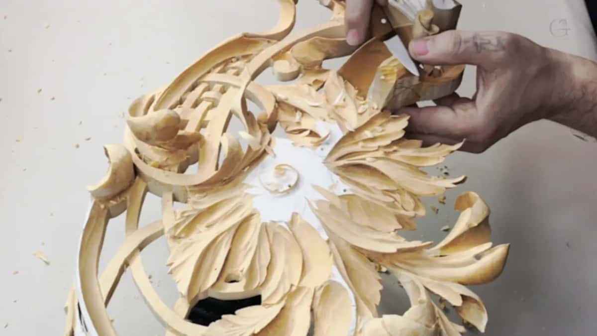 Deeply carved leaves radiating from a small spiral, every facet left standing