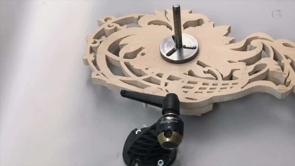 Steel post and disc screwed to the sawn blank above the vise
