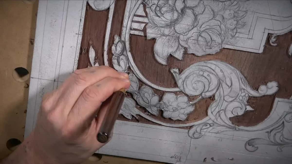 Dark handled gouge following a drawn outline