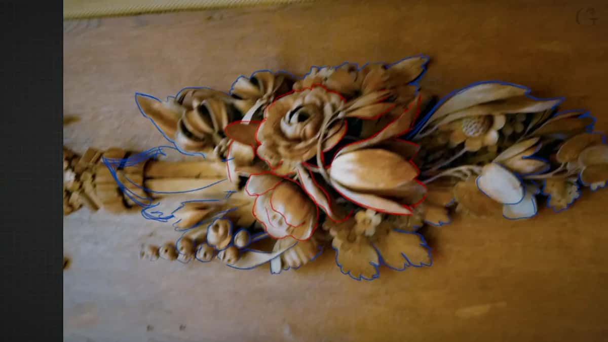 Photograph of the original Gibbons carving with the upper layer outlined in red and the lower one in blue
