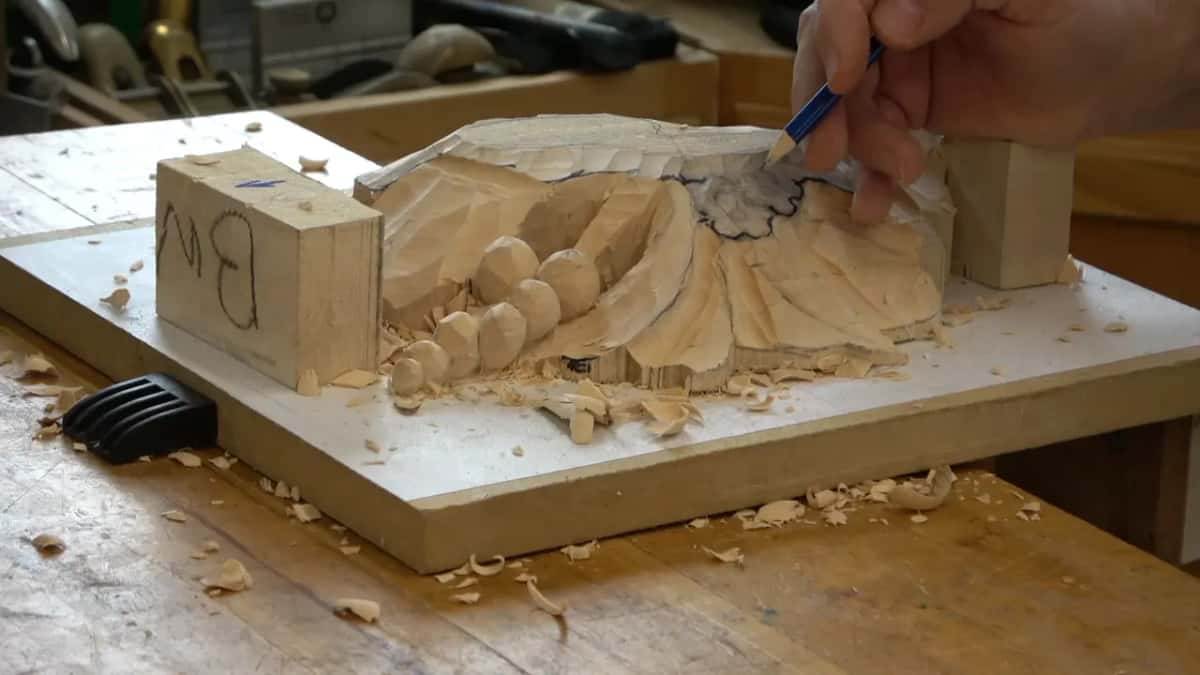 Drawing a flower onto the roughed lower layer, leg tabs still standing at both ends