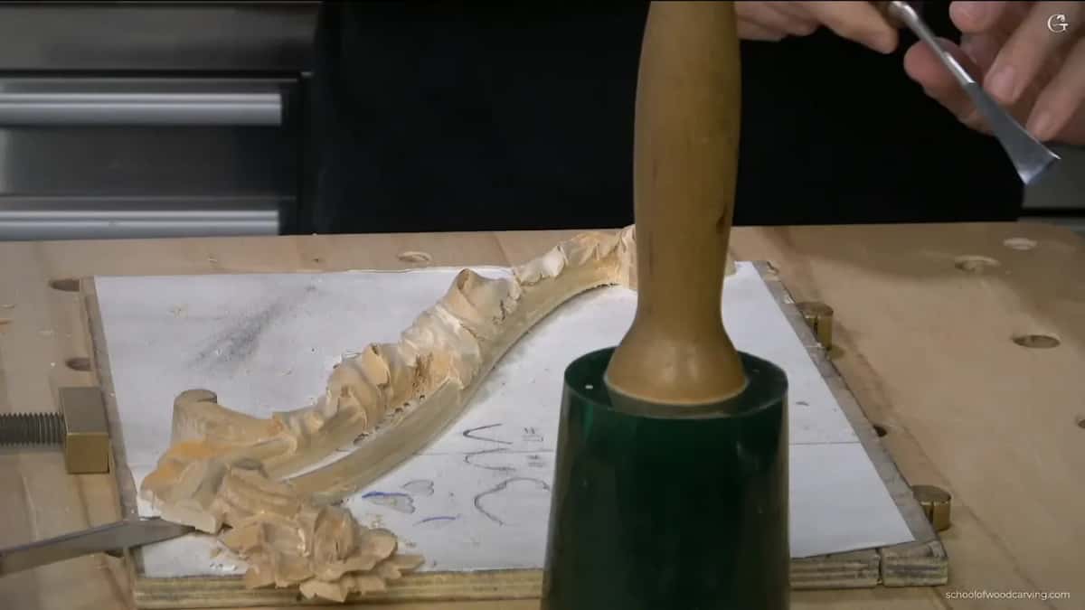 Mallet on the chisel handle.