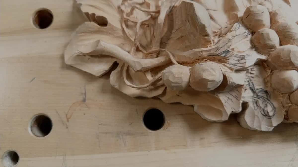 Carved curl twisting on itself