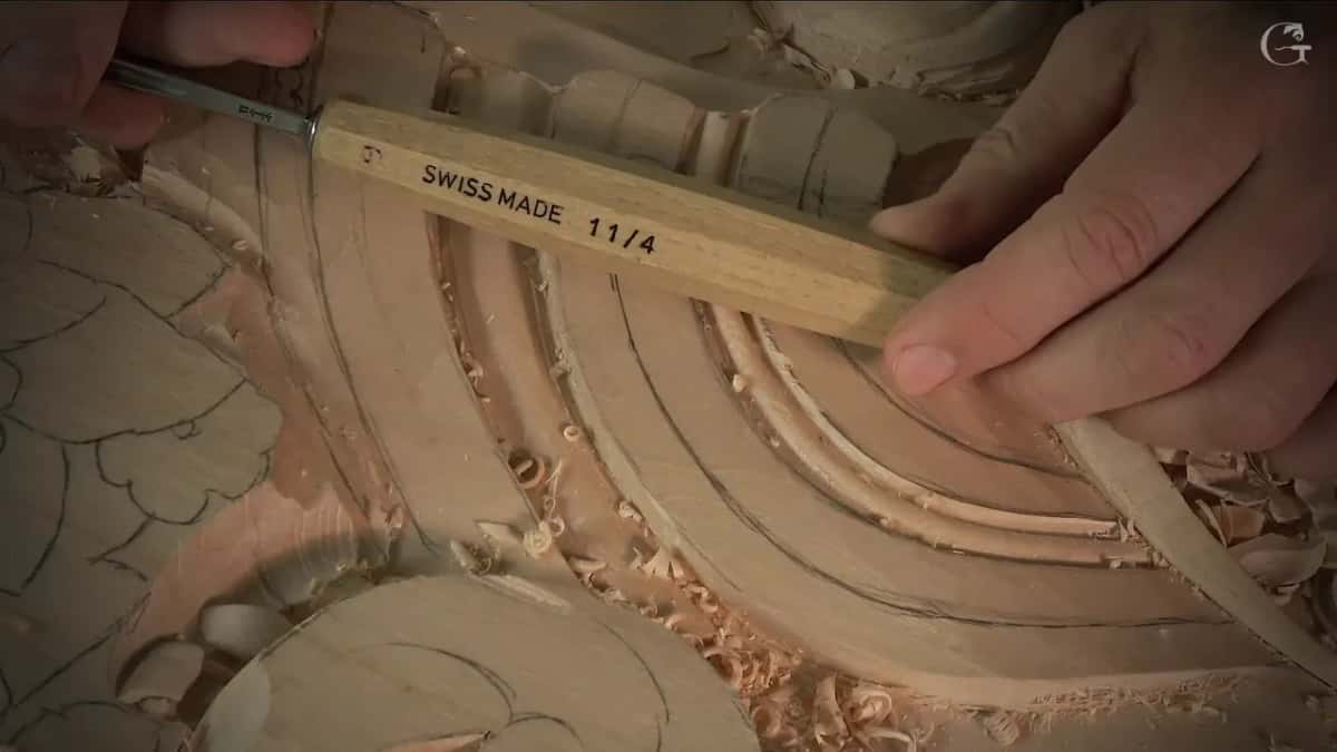 Chisel handle stamped SWISS MADE 11/4 laid along the carved bands