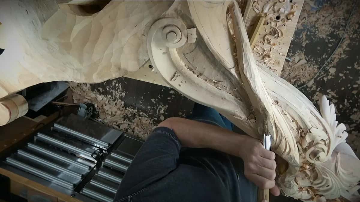 Folding it back Corbel standing almost upright with a forearm across it, and the scroll saw table down below in the dark