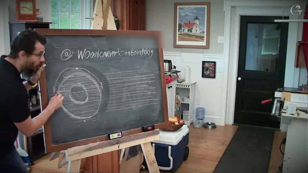 His chalk on the left edge of the donut while the grain lines run off to the right