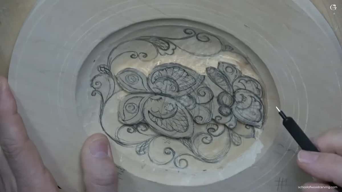 Nearly the whole field is drawn, curls on every side of both butterflies, the pencil held off to the right