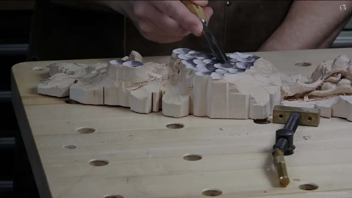 Long board clamped in its vice, the far half not started