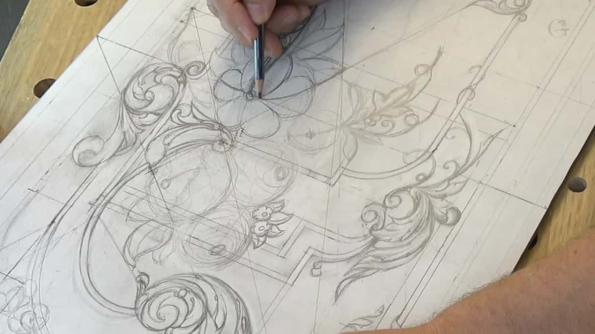 Outline of a big flower taking shape under a blue pencil