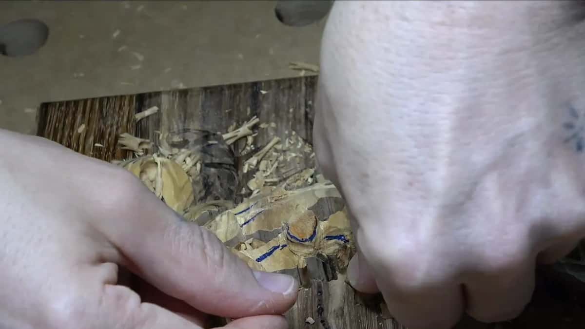 Both hands press the loose piece back down