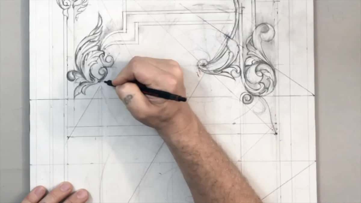 Black pencil touching the lowest lobe of a leaf beside the stepped molding line
