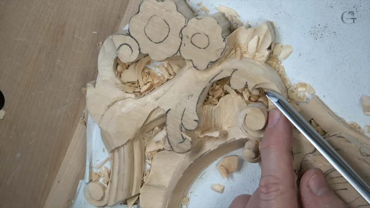 Gouge entering on its left corner and rotating through a full turn as the cut runs, which is how the hollow comes out even