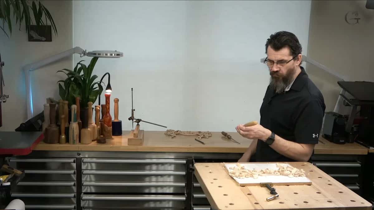 At the bench, checking the piece between passes