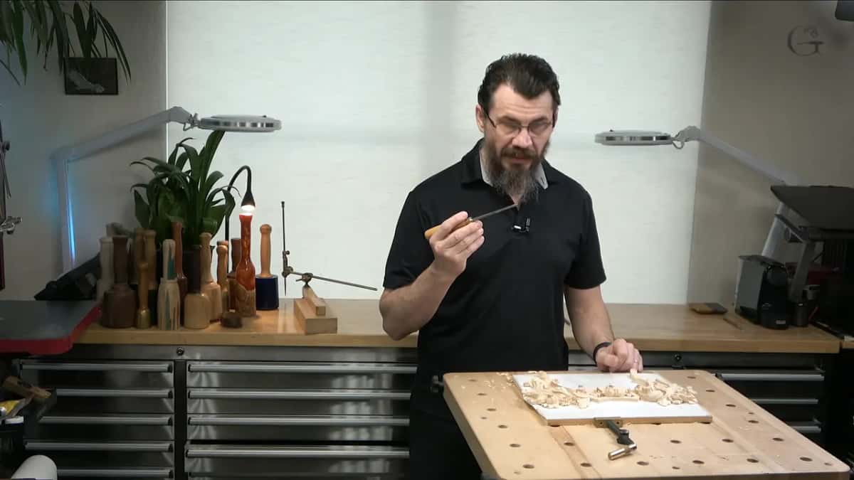 Maker's name showing on the blade of a gouge held up to camera