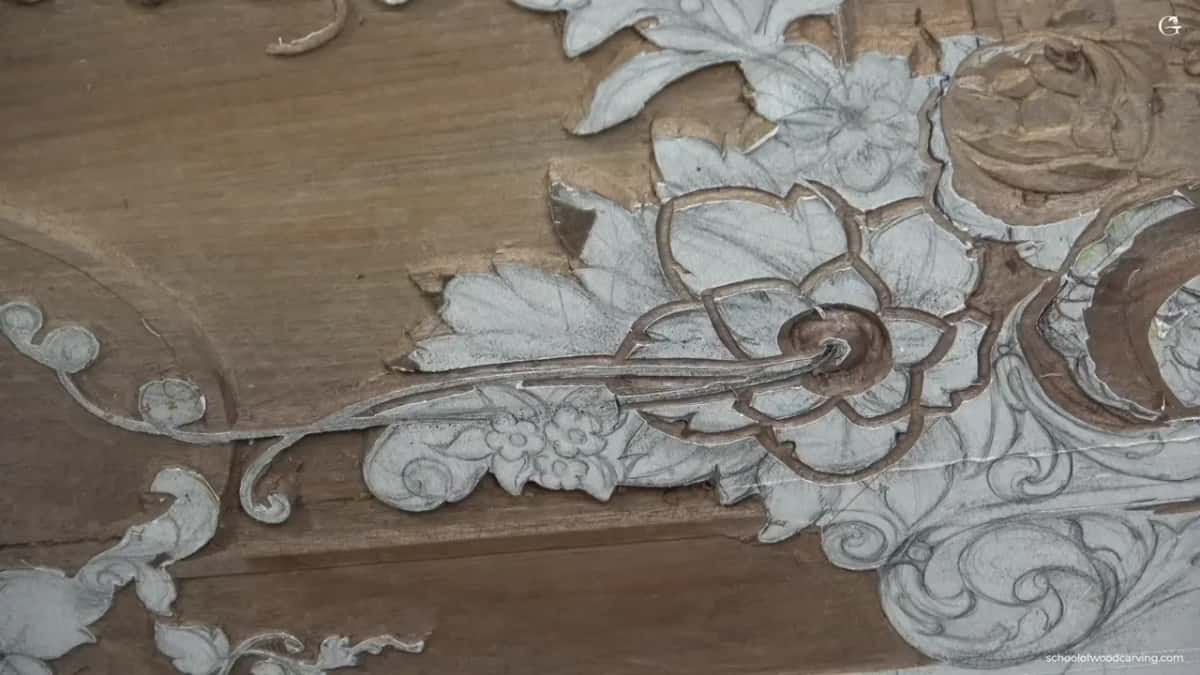Chalk over walnut, and a small dark opening in the place where flat wood used to be.