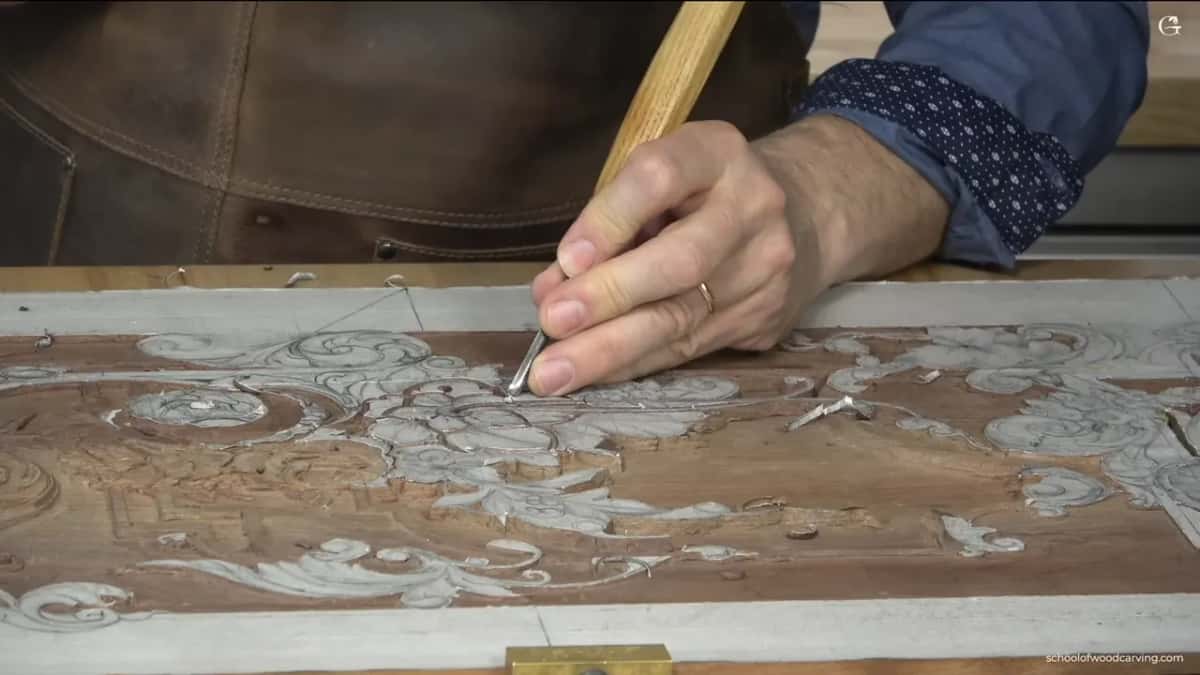 Seen from above, his arm crosses the whole panel and the full design shows at once.