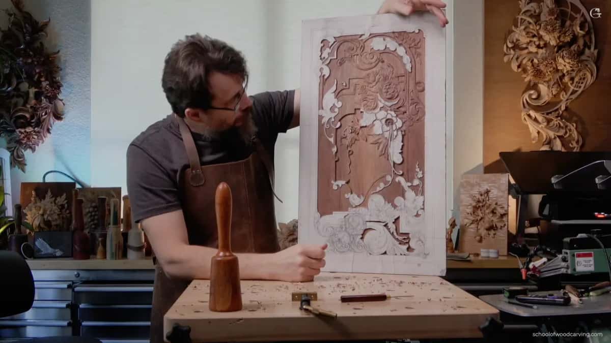 Alexander holding the panel upright at his bench.