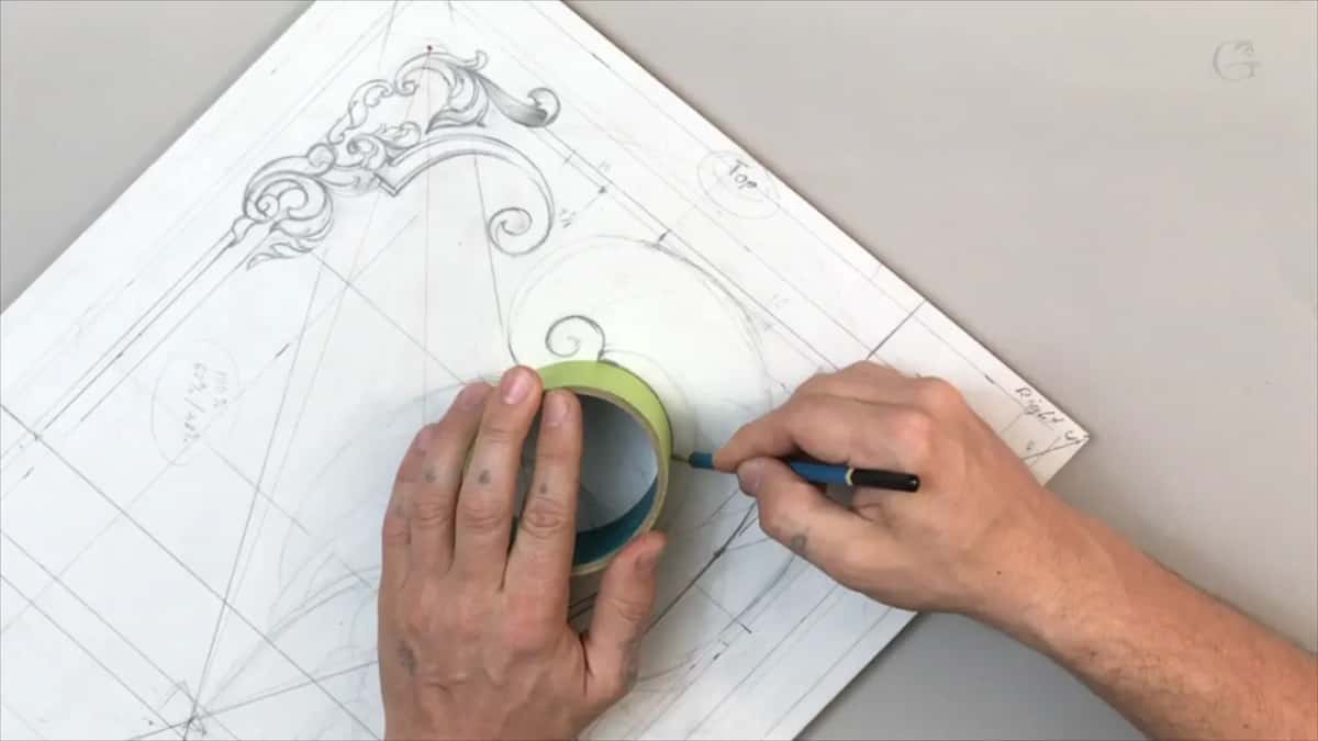 A roll of tape held against the drawing as a curve guide with the pencil following its edge