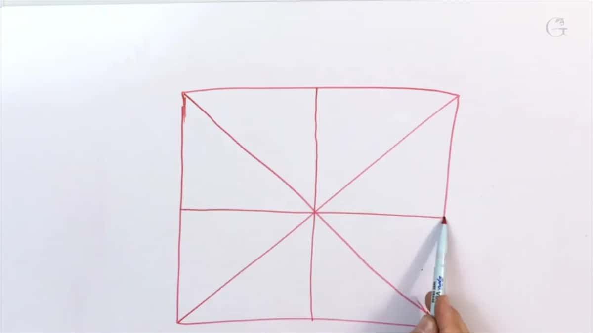 Red square on paper with both diagonals and a center cross ruled through it