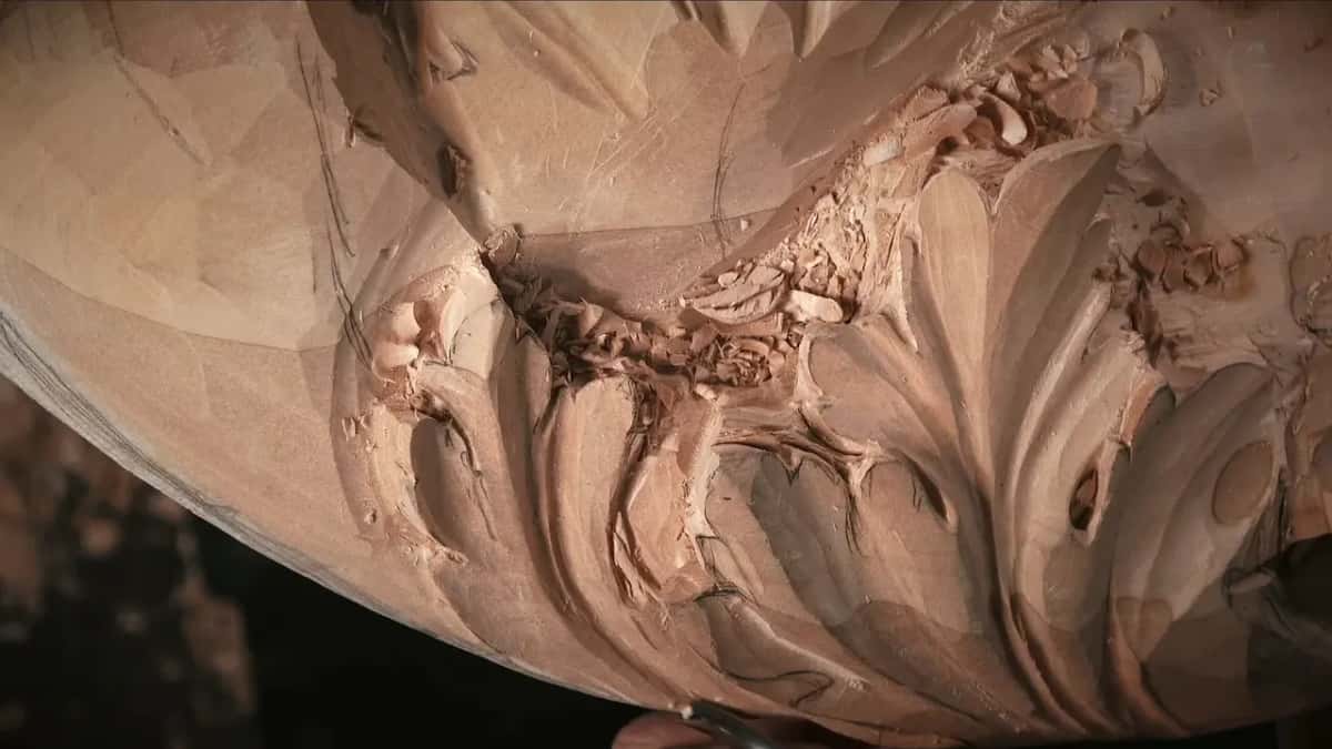 The same lobes, no hands in view, a few chips resting in the middle hollow.