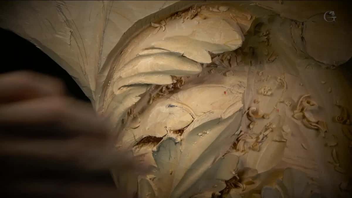 The eye Stacked lobes, deep hollows, a hand blurred at the near edge