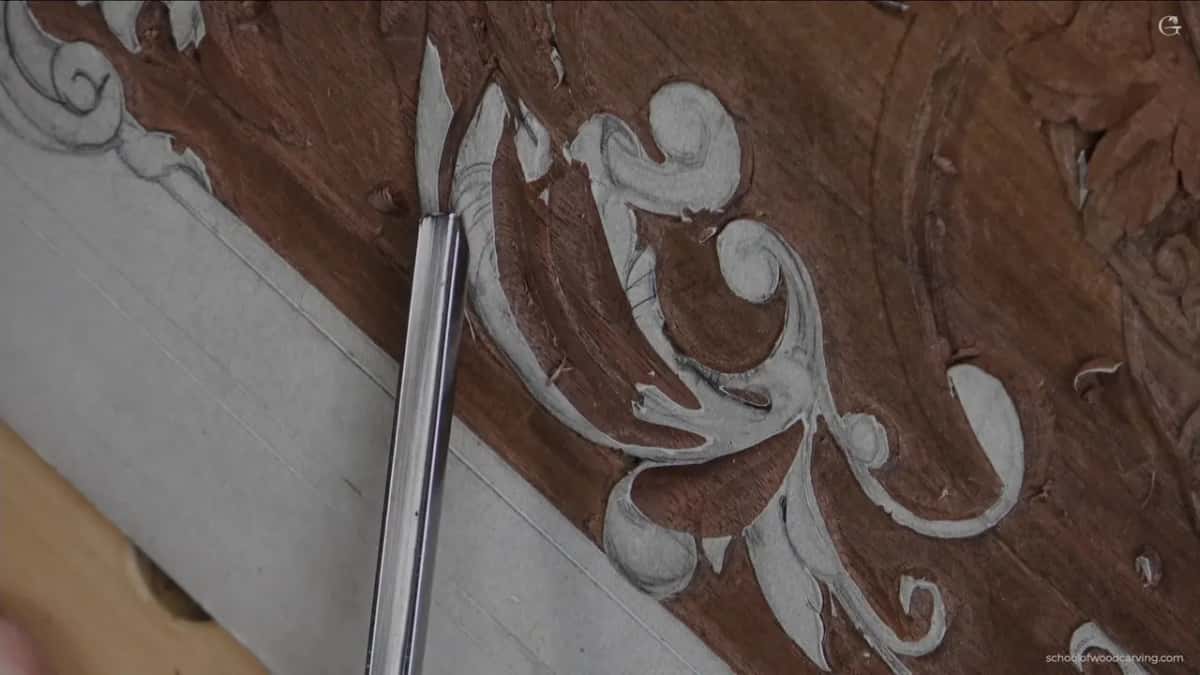 Bright steel laid along the scroll.