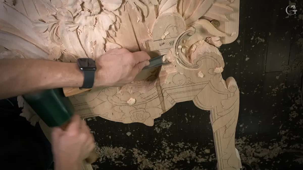 Mallet in one hand and a chisel in the other, with a pencil note reading 6 mm beside them
