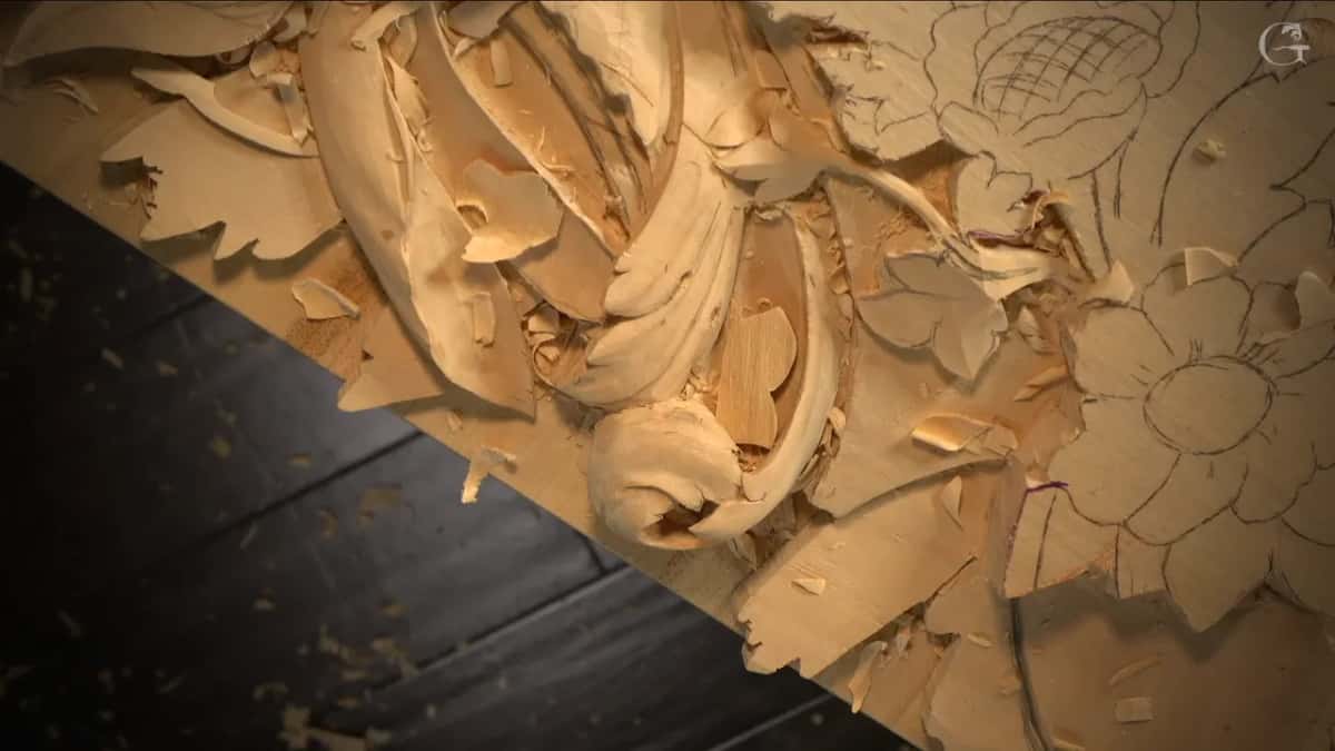 Carved acanthus scroll on the left, pencil flower on the right, no hands in the picture.