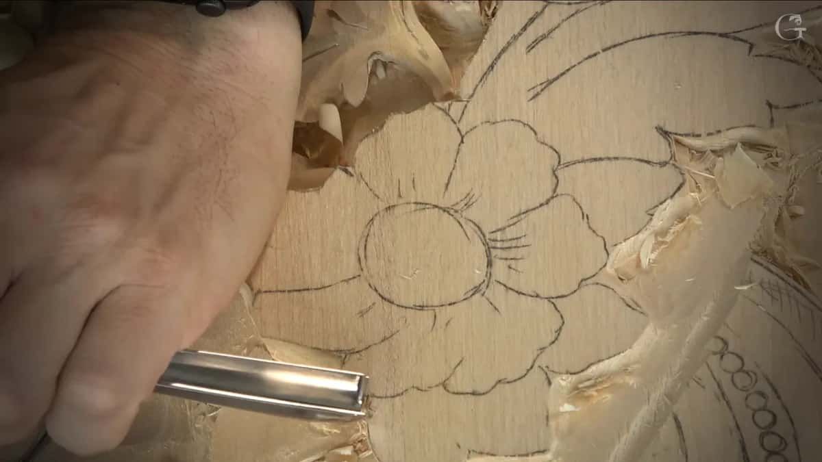 Straight gouge at the flower edge.