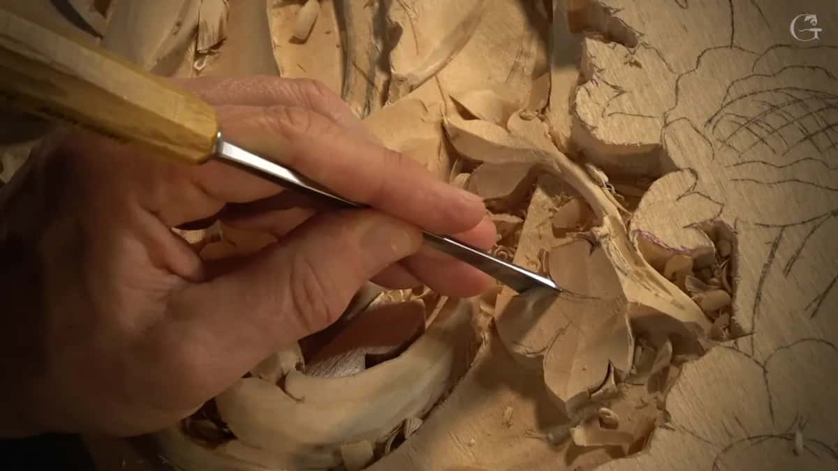 Close view of a thin blade in his fingers.