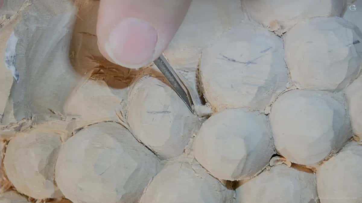 Thumb steady, thin blade cutting a chamfer