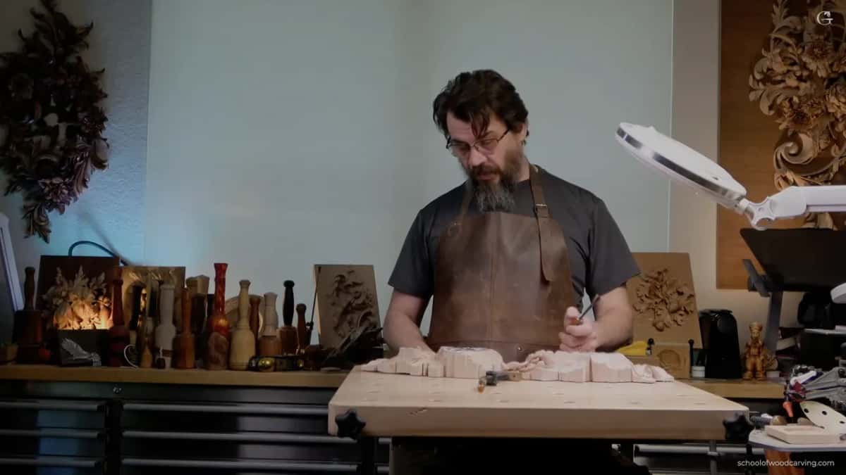 Alexander at his bench in a leather apron