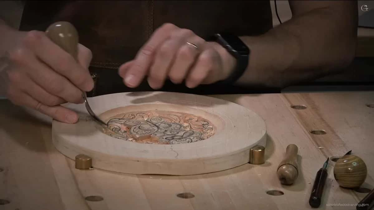 Bent blade reaching into the plate from the left