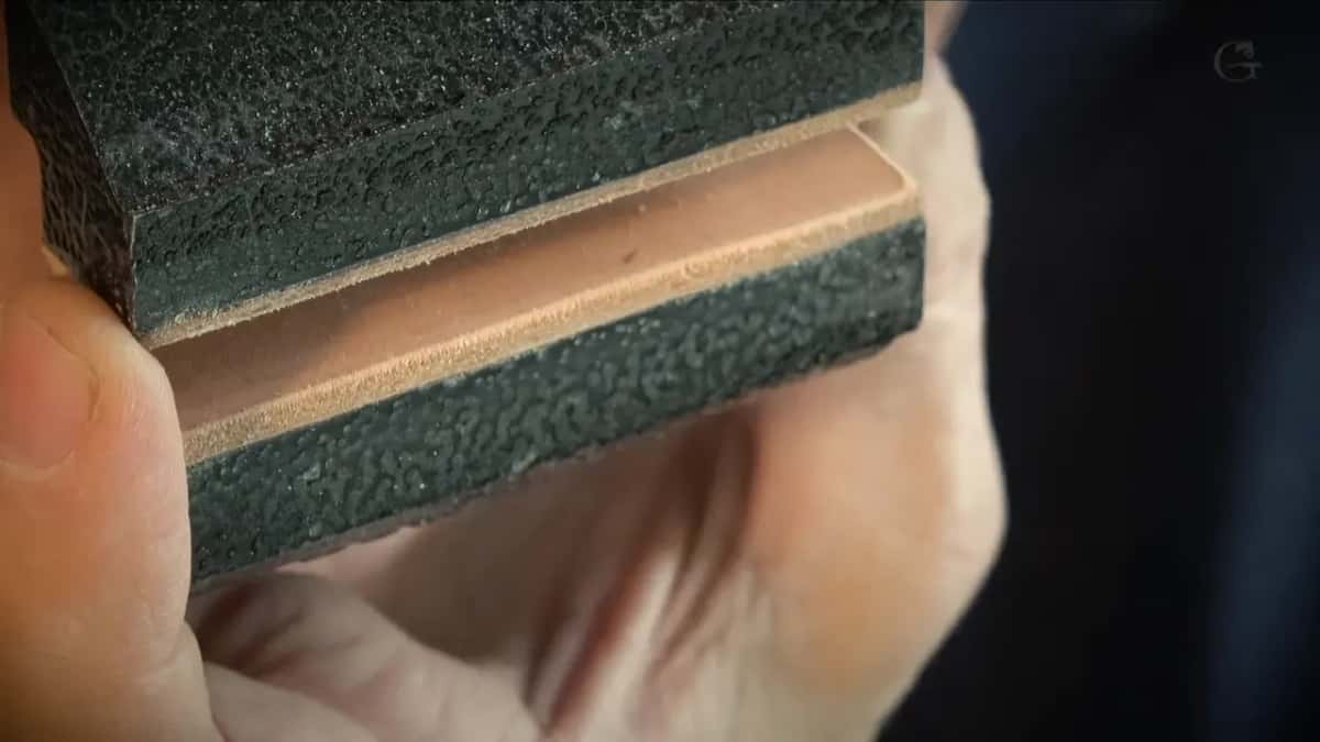 Thick tan leather facing both black jaws