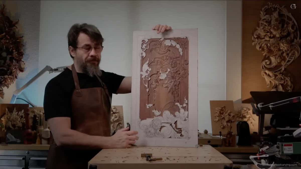 Alexander holding the panel upright for the camera.