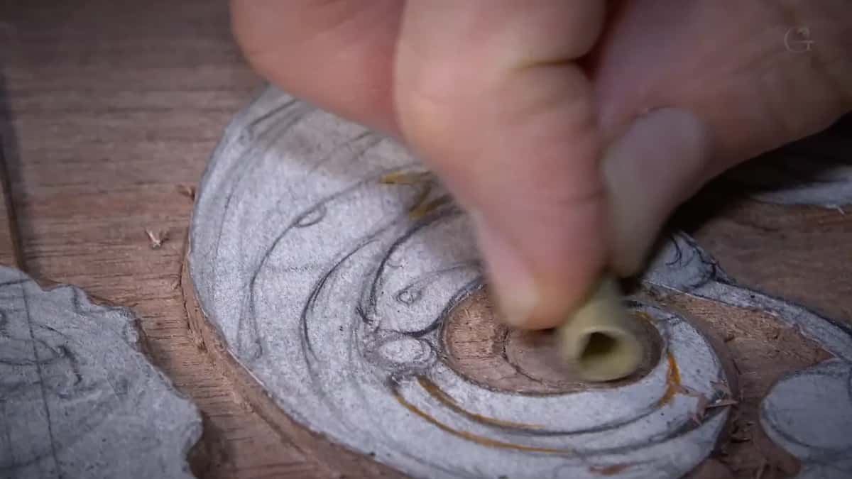 Reed stem pressed into the middle of the volute