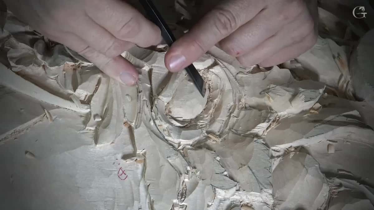 Two hands guide one small tool