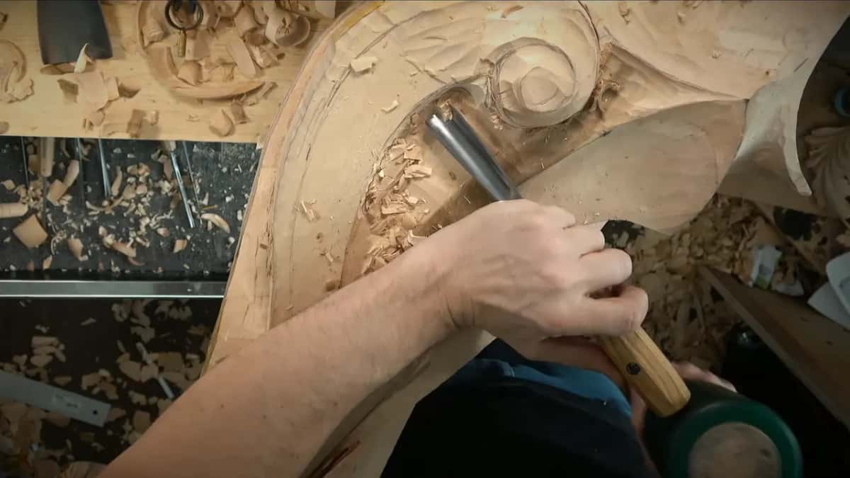 Green mallet below, gouge in the hollow