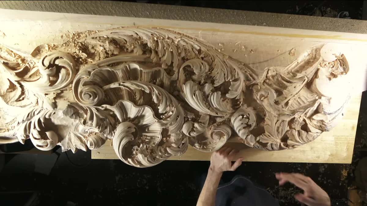 Hands resting at the edge of a deep Venetian panel