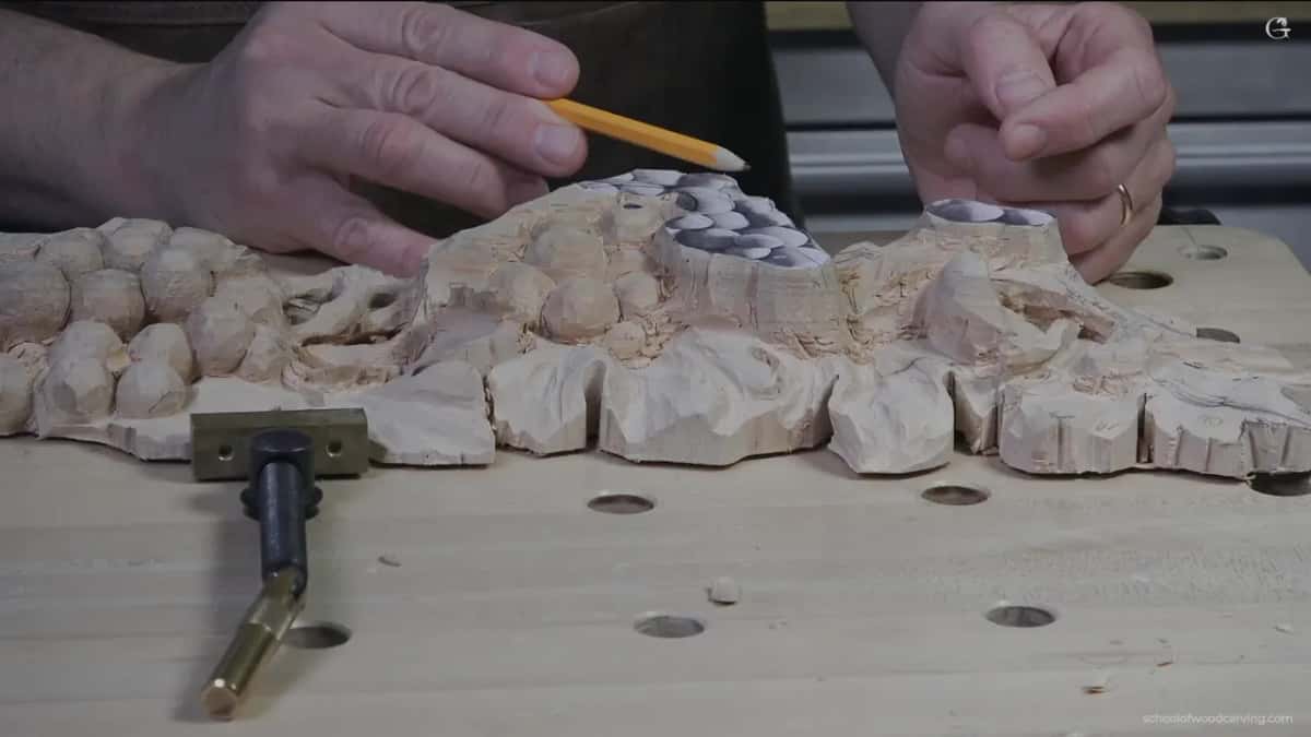 Pencil in hand against the uncarved edge