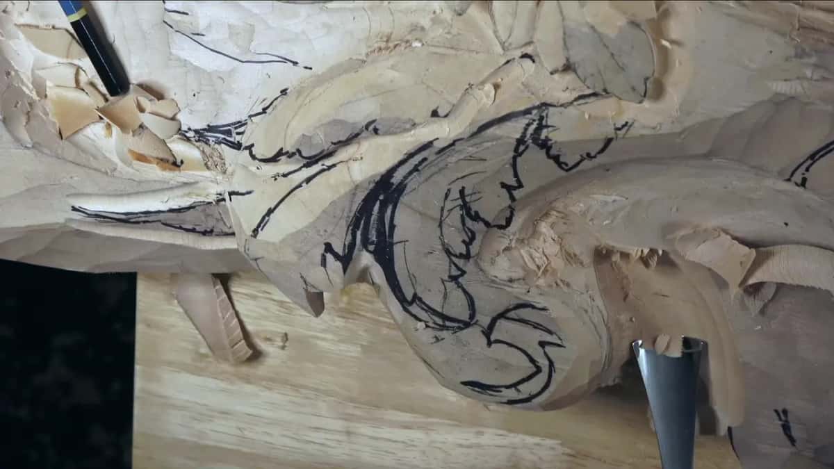 Wide gouge at the foot of the marked head.