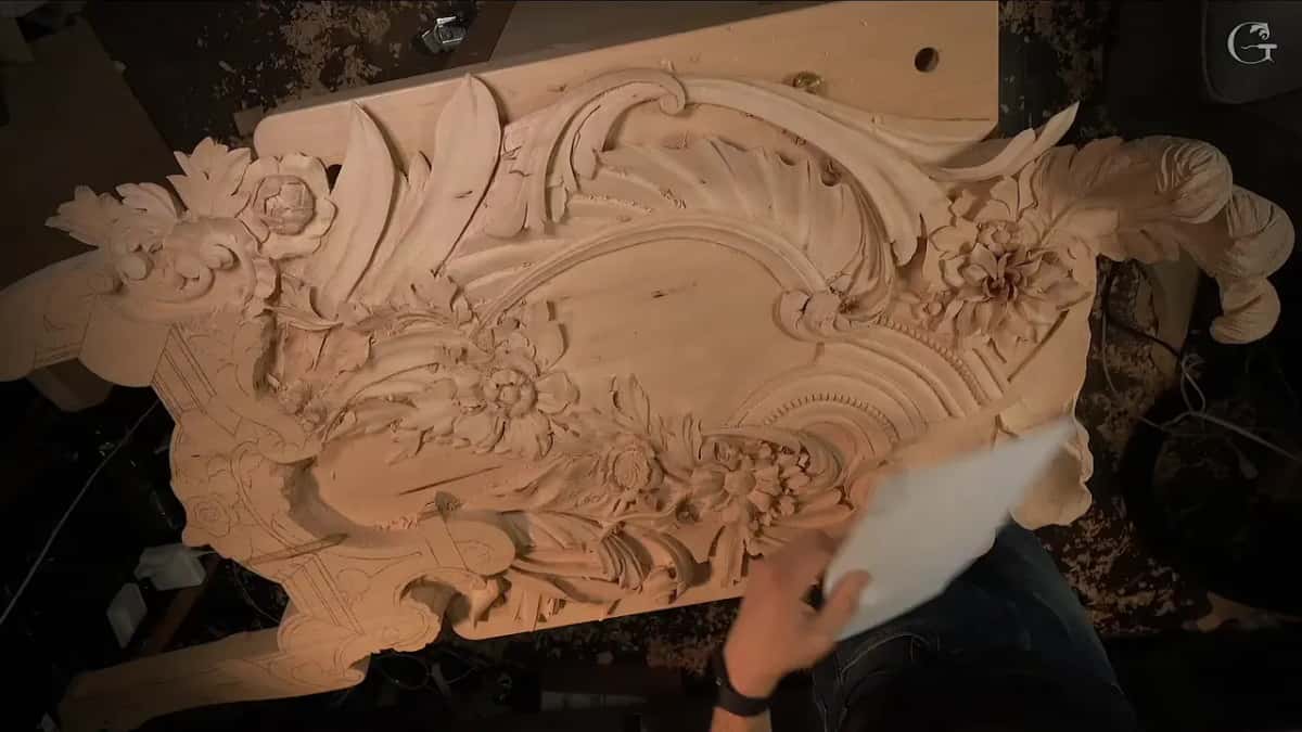 A sheet of paper held up over the carving