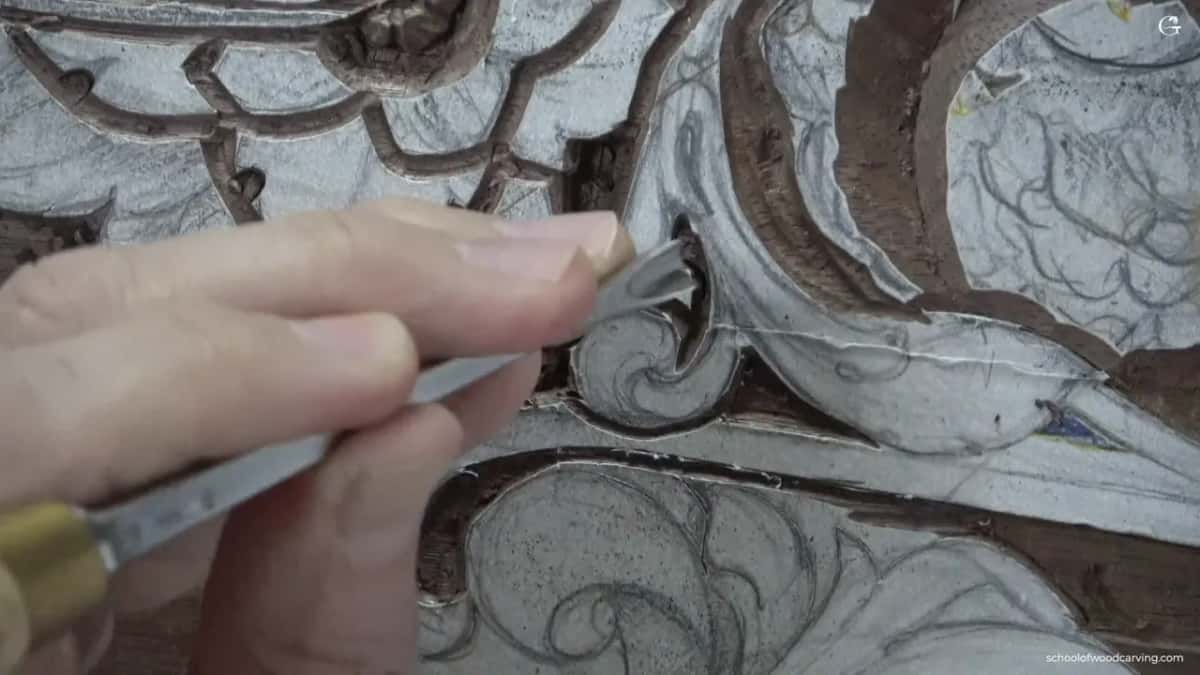 Brass ferrule against chalked acanthus.